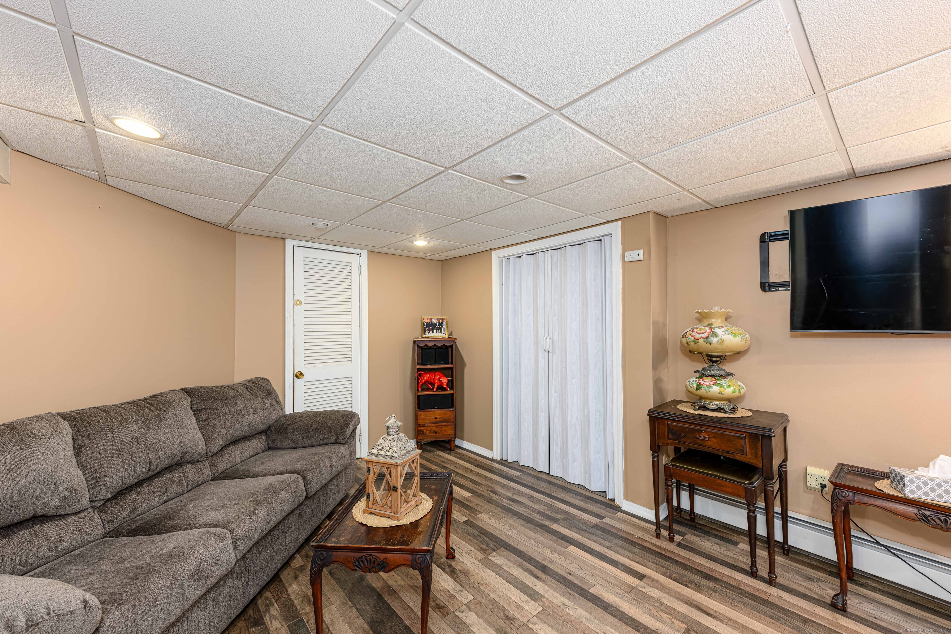 201 Rimmon Road North Haven, CT 06473 - Photo 2 of 40 a living room with furniture and a flat screen tv