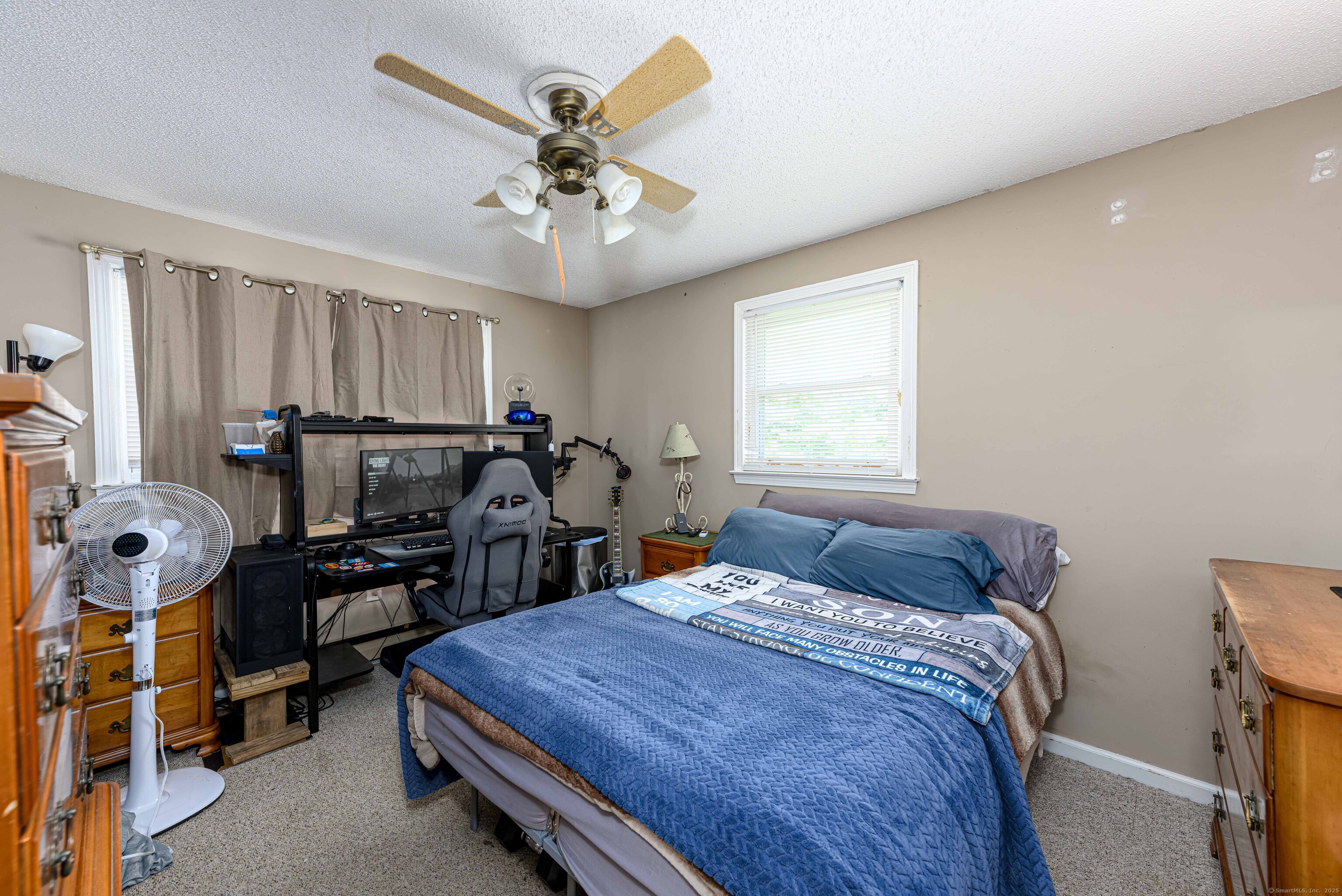 201 Rimmon Road North Haven, CT 06473 - Photo 25 of 40 a bedroom with a bed and a chandelier