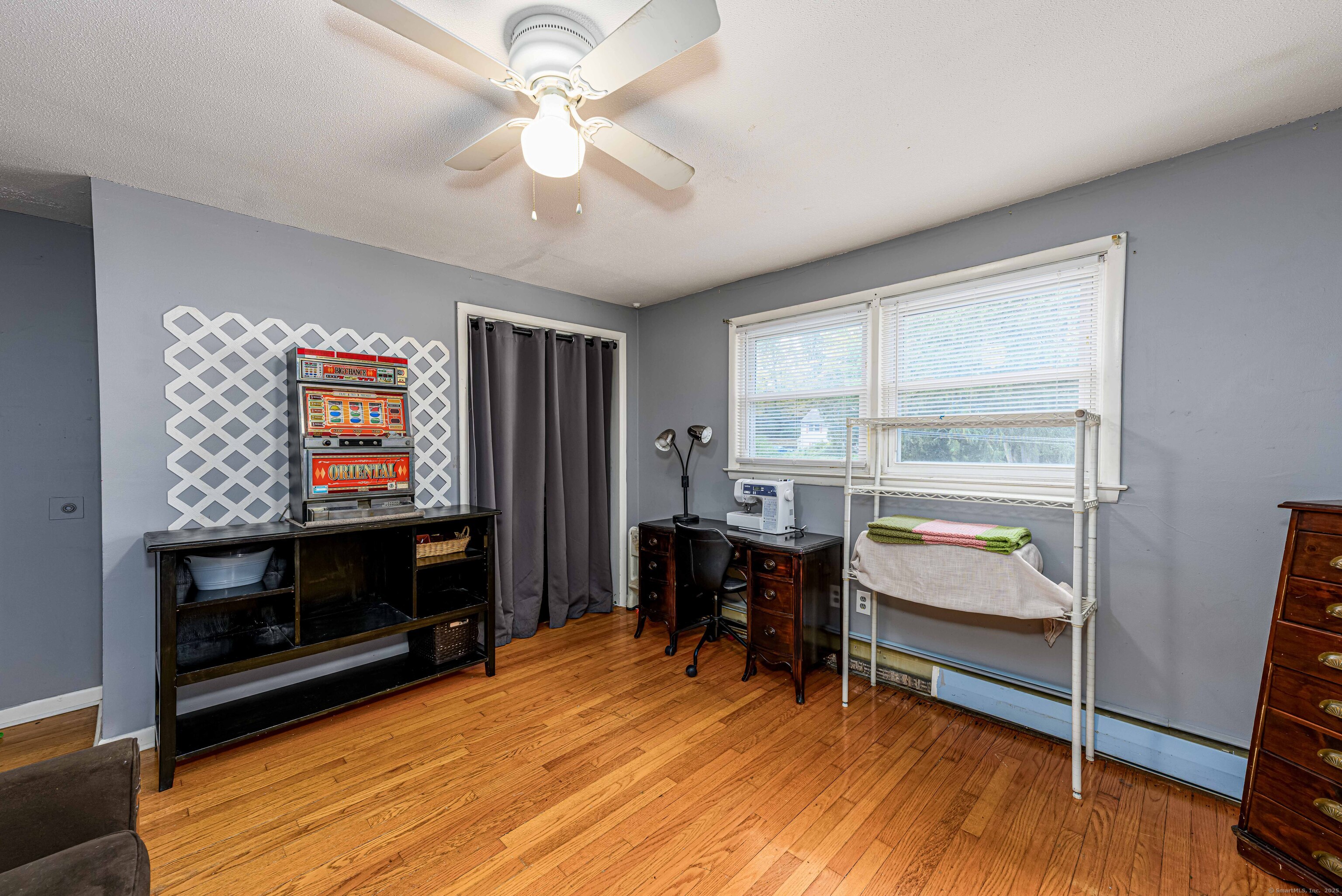 201 Rimmon Road North Haven, CT 06473 - Photo 27 of 40 a living room with furniture a fireplace and a flat screen tv