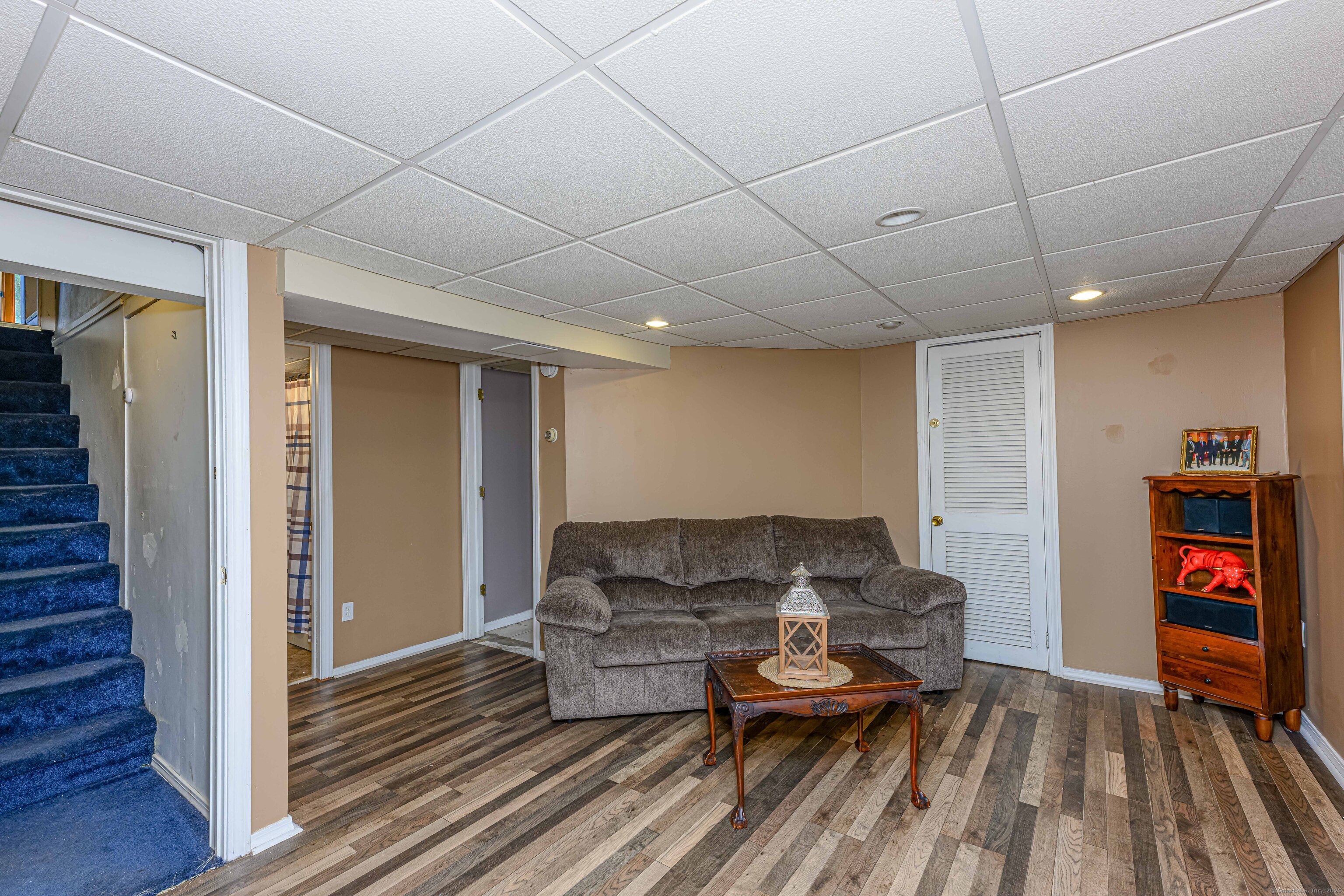 201 Rimmon Road North Haven, CT 06473 - Photo 32 of 40 a living room with furniture and a wooden floor