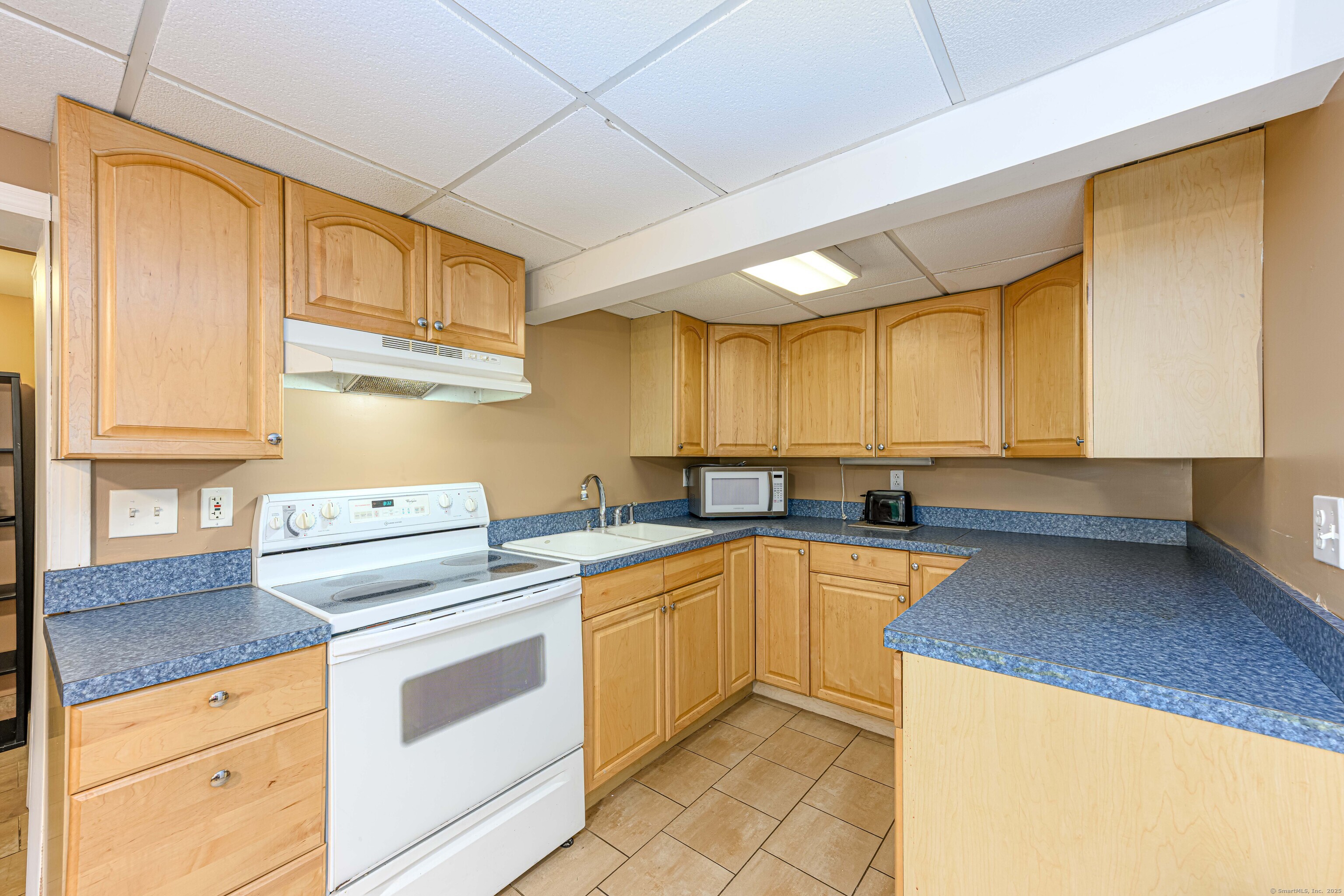 201 Rimmon Road North Haven, CT 06473 - Photo 4 of 40 a kitchen with appliances cabinets and a sink