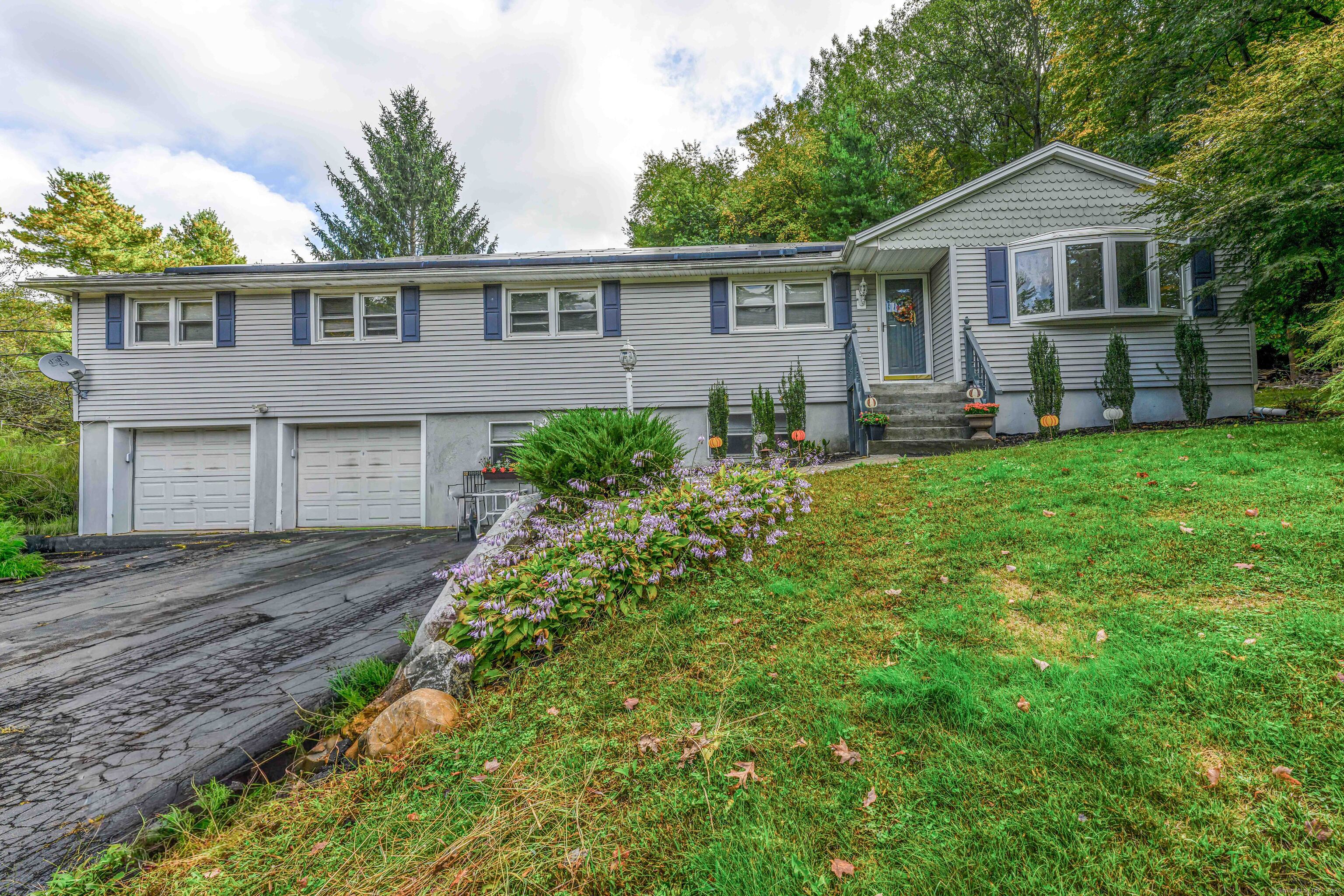 201 Rimmon Road North Haven, CT 06473 - Photo 5 of 40 a front view of a house with a yard and porch