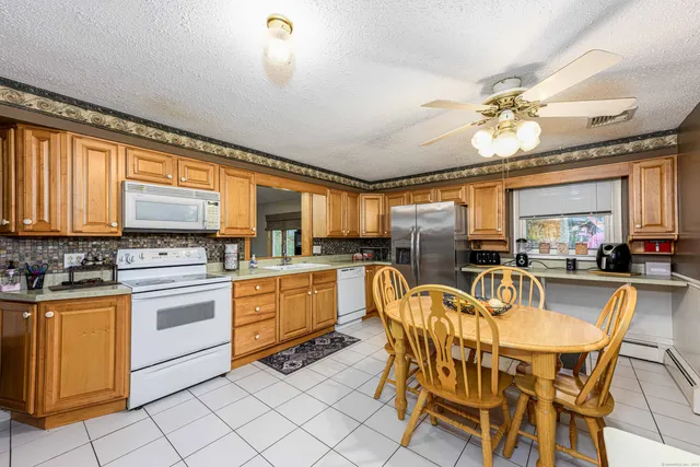 a view of a dining room kitchen and a window