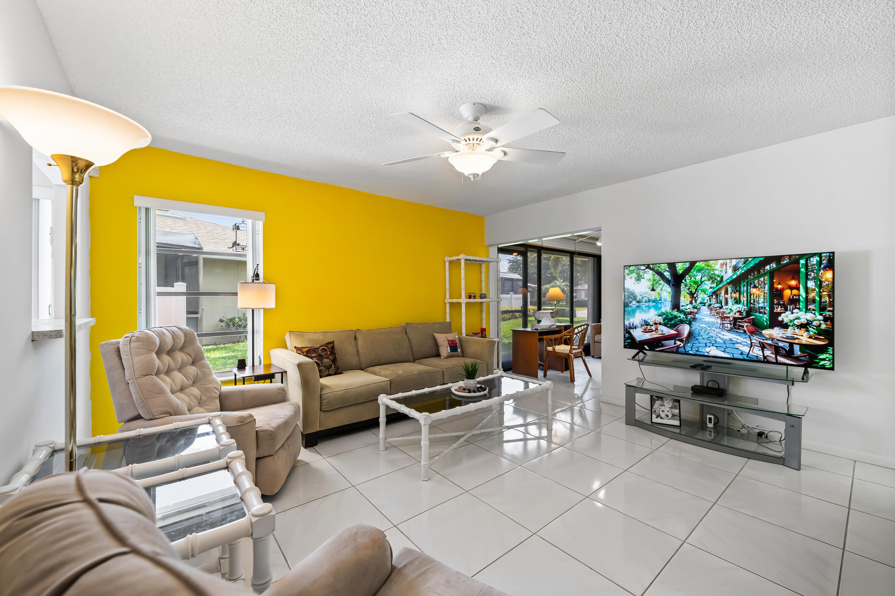 18762 Candlewick Drive Boca Raton, FL 33496 - Photo 29 of 52 a living room with furniture and a flat screen tv