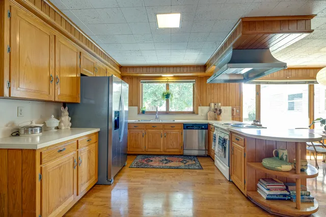 a kitchen with a stove and cabinets