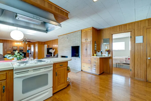 a bathroom with a sink a toilet and shower curtain