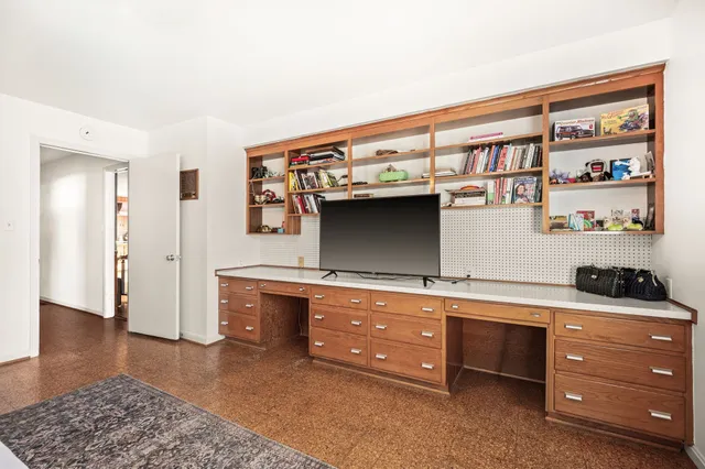 a kitchen with stainless steel appliances granite countertop a sink a stove and a wooden cabinets