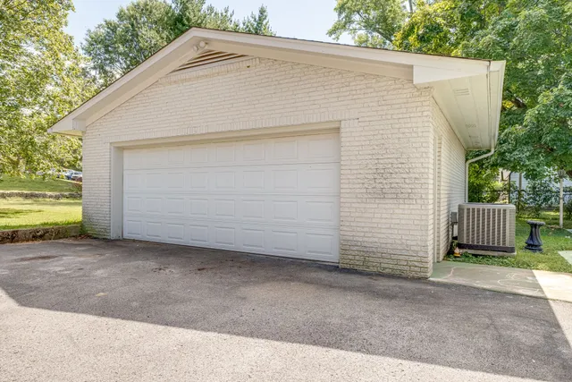 a front view of a house with a garage