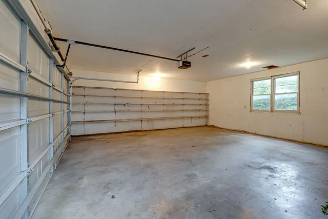a front view of a house with a garage