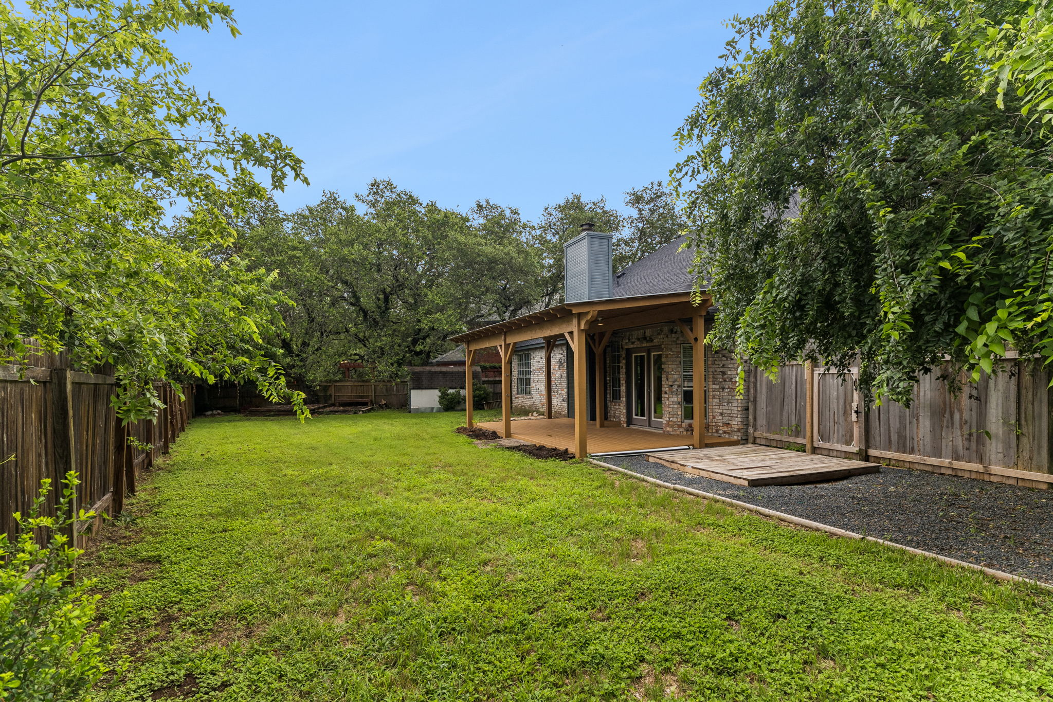 10400 O'Rourk Lane Austin, TX 78739 - Photo 32 of 33 a front view of a house with a yard
