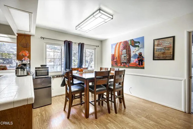 a living room with furniture and next to a window