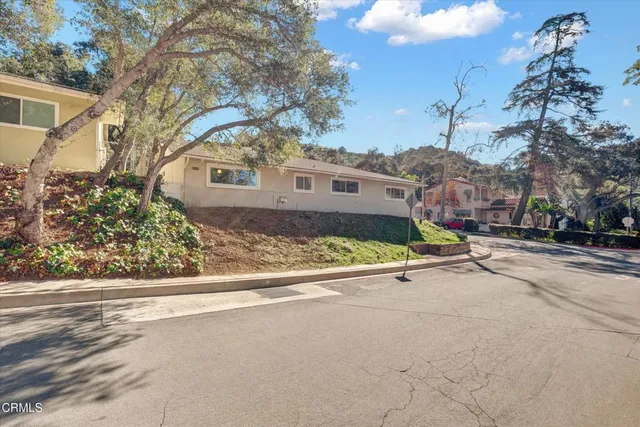 a view of a house with a yard and garage