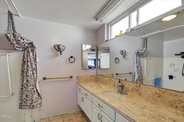 a view of a bedroom and bathroom