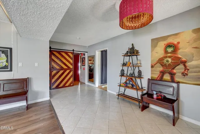 a view of a livingroom with furniture and cabinet