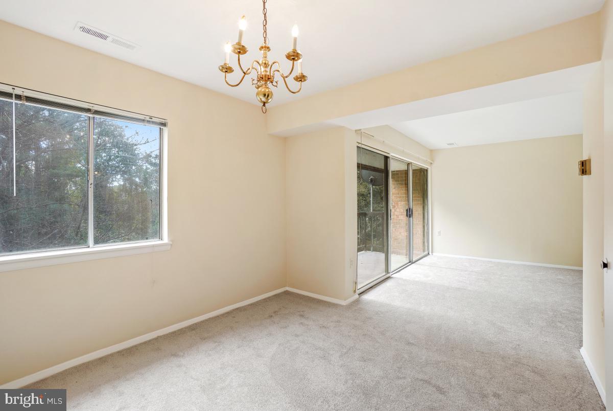 18610 Walkers Choice Road, Unit 18610 Gaithersburg, MD 20886 - Photo 15 of 30 a view of an empty room with a window
