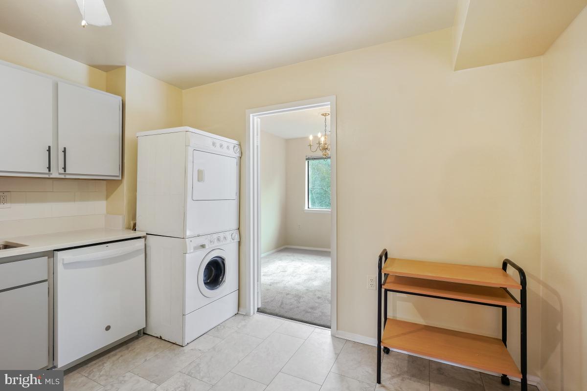 18610 Walkers Choice Road, Unit 18610 Gaithersburg, MD 20886 - Photo 20 of 30 a view of kitchen with refrigerator and white cabinets