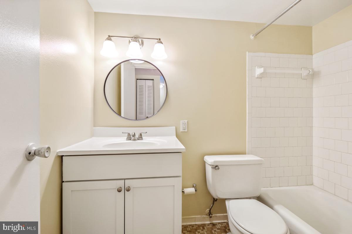 18610 Walkers Choice Road, Unit 18610 Gaithersburg, MD 20886 - Photo 22 of 30 a bathroom with a toilet sink and mirror