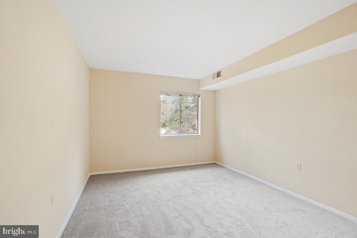 18610 Walkers Choice Road, Unit 18610 Gaithersburg, MD 20886 - Photo 26 of 30 a view of an empty room with a window