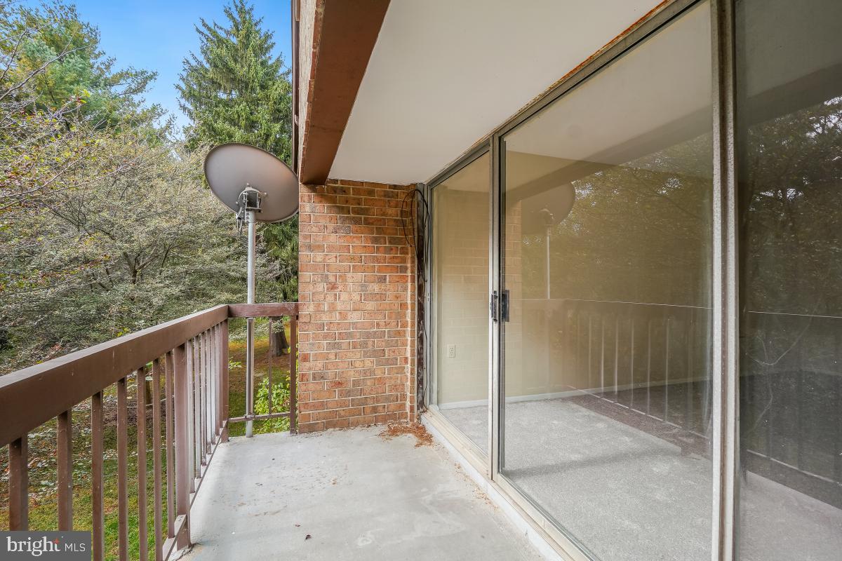 18610 Walkers Choice Road, Unit 18610 Gaithersburg, MD 20886 - Photo 10 of 30 a balcony view with a glass door