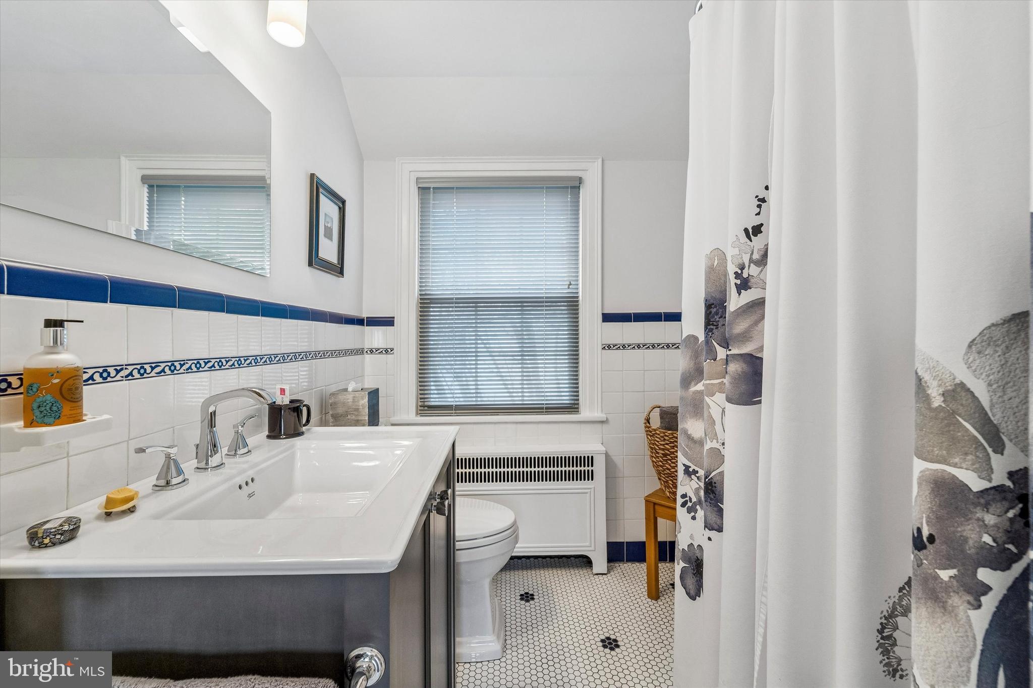8331 High School Road Elkins Park, PA 19027 - Photo 24 of 42 Updated hall bathroom with shower and tub.