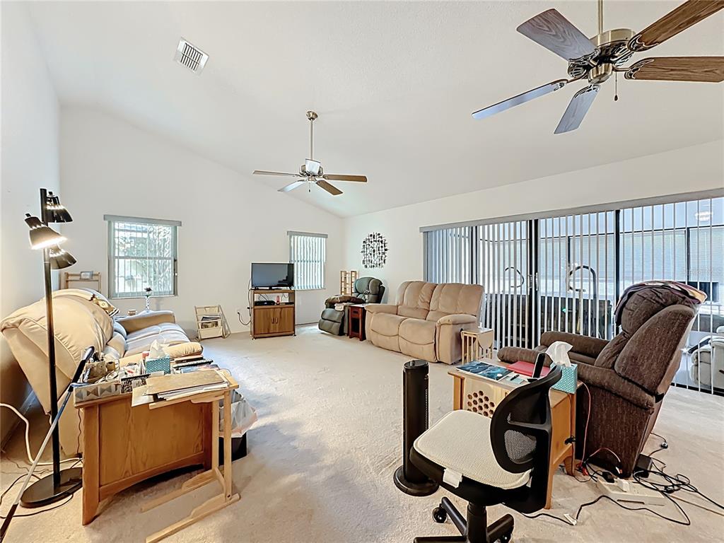 Undisclosed Address Winter Springs, FL 32708 - Photo 12 of 66 a living room with furniture