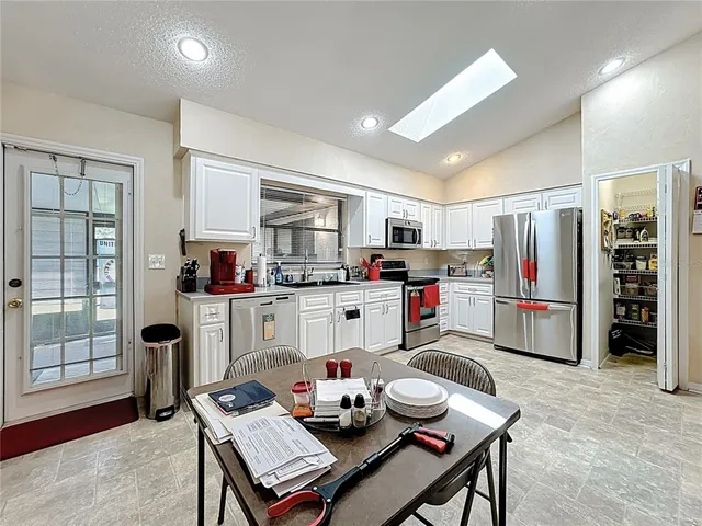 a room with furniture gym equipment and a window