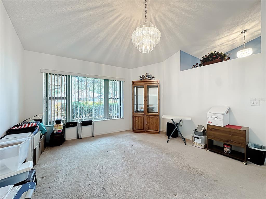 Undisclosed Address Winter Springs, FL 32708 - Photo 24 of 66 a living room with furniture and a large window