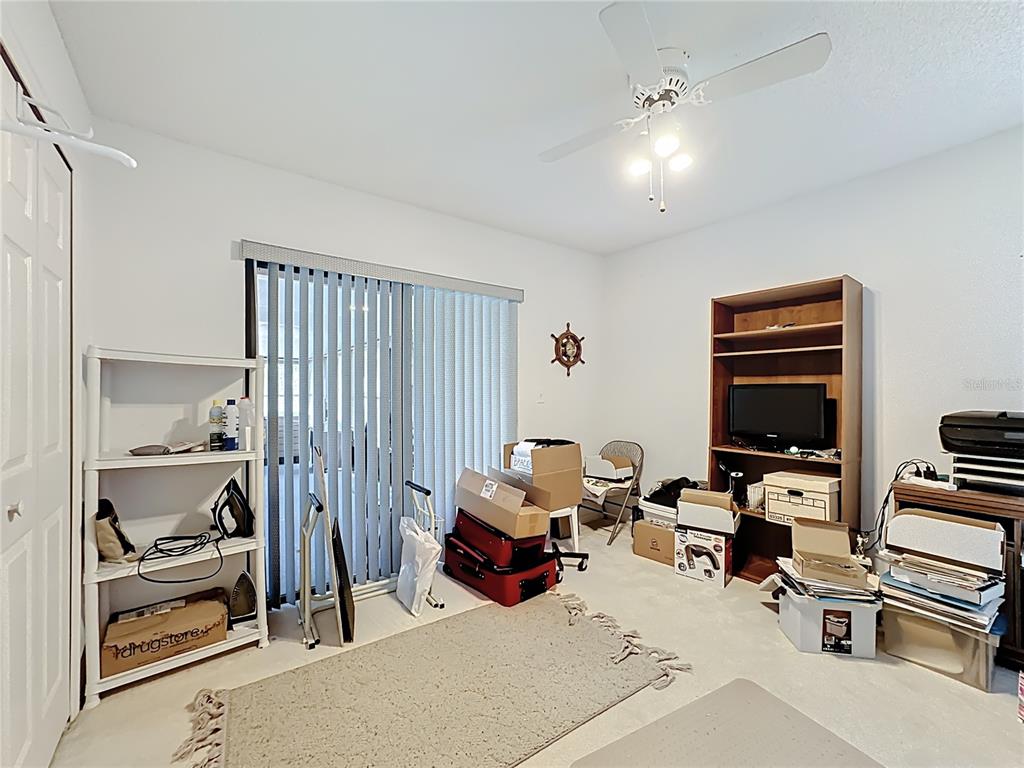Undisclosed Address Winter Springs, FL 32708 - Photo 29 of 66 a room with furniture gym equipment and a window