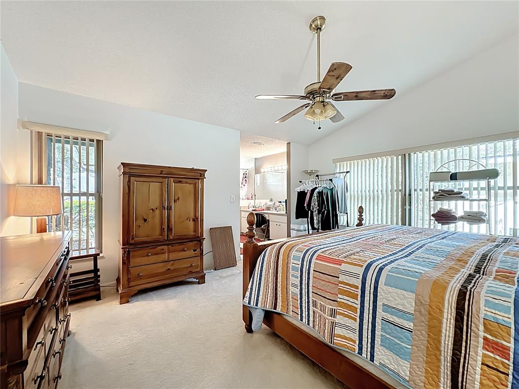 Undisclosed Address Winter Springs, FL 32708 - Photo 33 of 66 a bedroom with a bed chandelier and a window