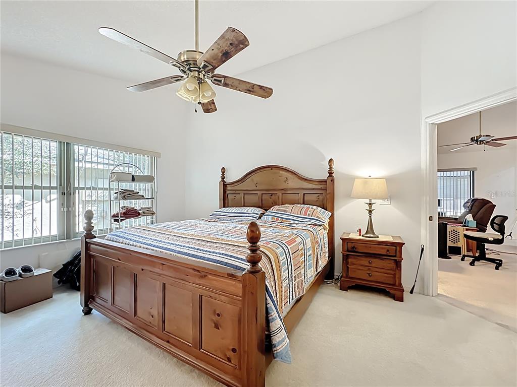 Undisclosed Address Winter Springs, FL 32708 - Photo 34 of 66 a bedroom with a bed and a chandelier