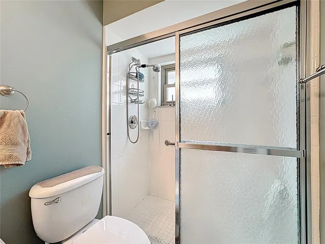 an aerial view of a houses with a yard