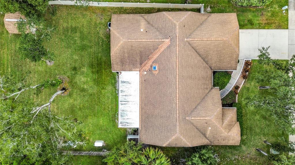 Undisclosed Address Winter Springs, FL 32708 - Photo 59 of 66 an aerial view of a house with a yard and plants