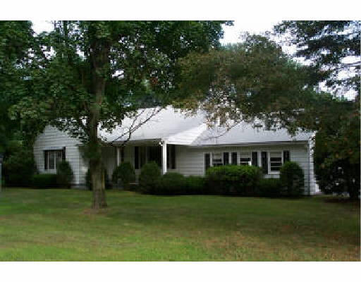 639 Springfield Street Wilbraham, MA 01095 - Photo 1 of 1 a front view of house with a garden
