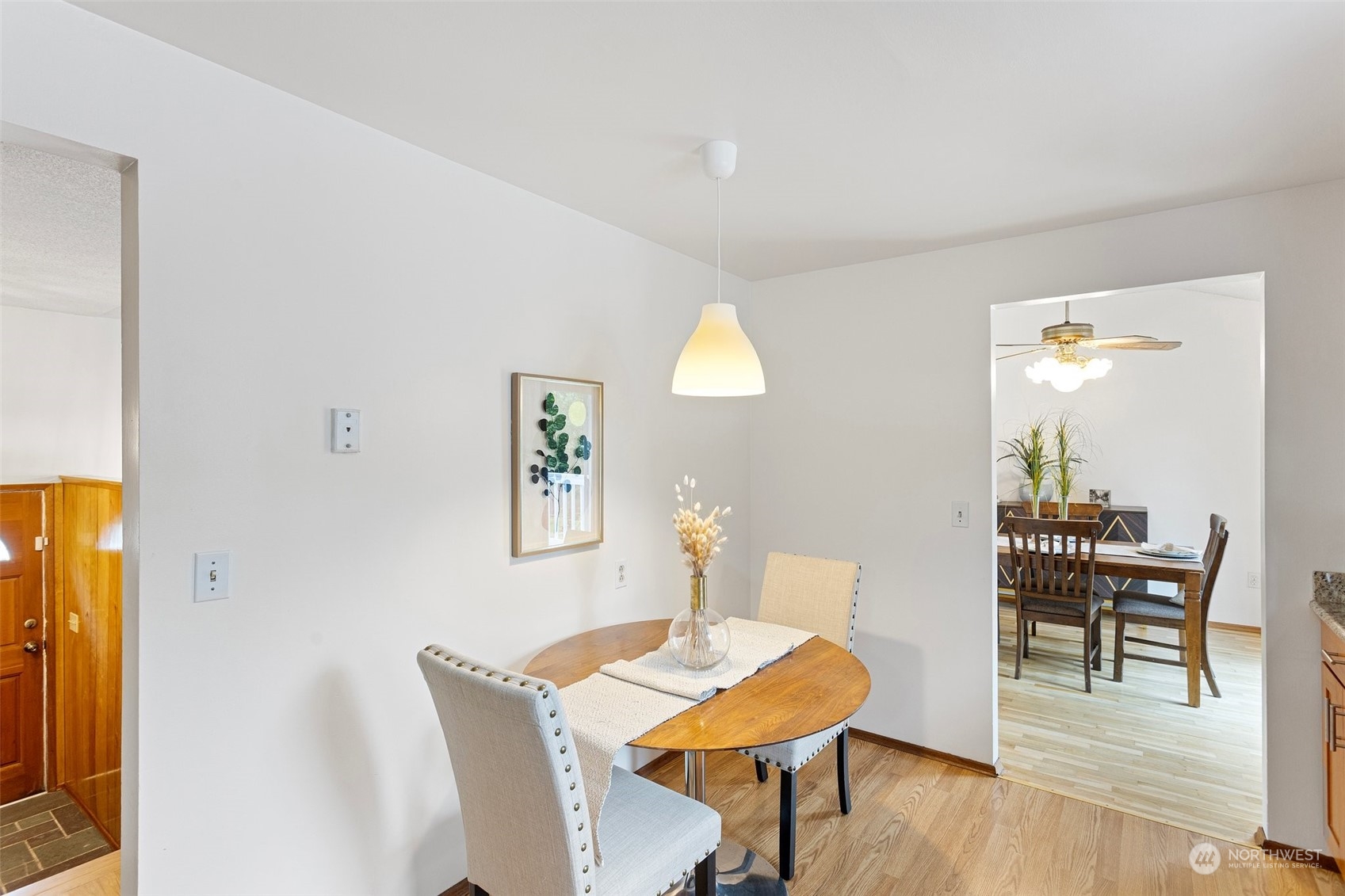 331 North 200th Street Shoreline, WA 98133 - Photo 11 of 28 a view of a dining room with furniture and wooden floor
