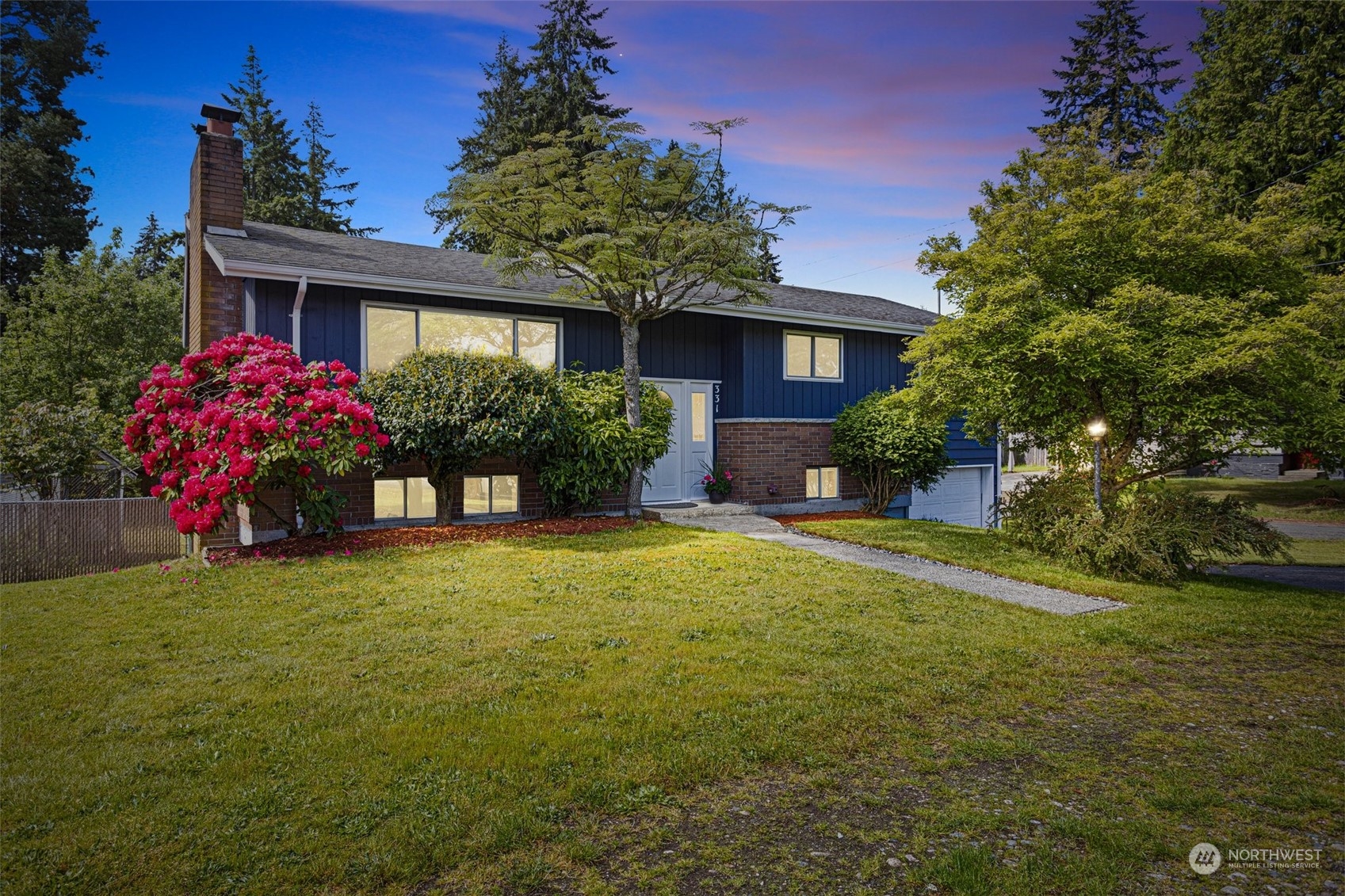 331 North 200th Street Shoreline, WA 98133 - Photo 2 of 28 a front view of a house with yard and green space