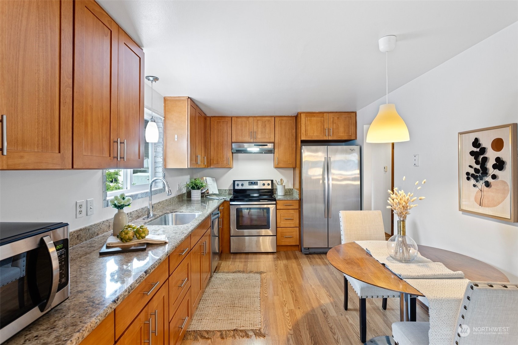 331 North 200th Street Shoreline, WA 98133 - Photo 8 of 28 a kitchen with stainless steel appliances a stove a sink dishwasher and a refrigerator