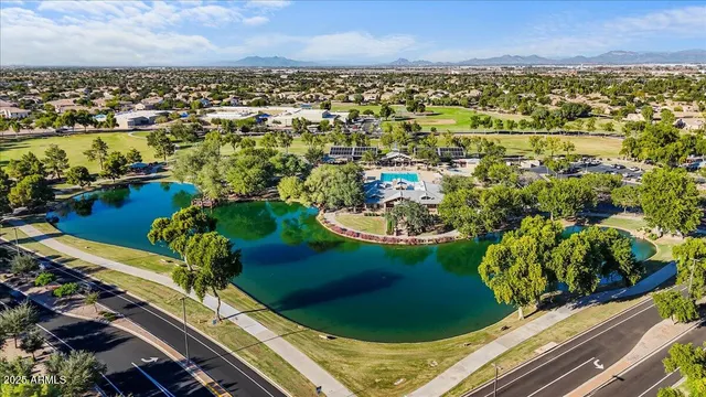 an aerial view of a residential houses with outdoor space