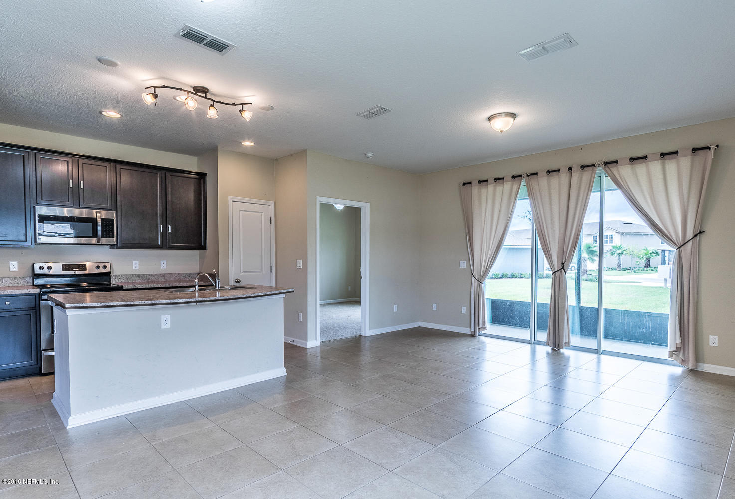 3131 Chestnut Ridge Way Orange Park, FL 32065 - Photo 5 of 27 Kitchen Living Room Combo
