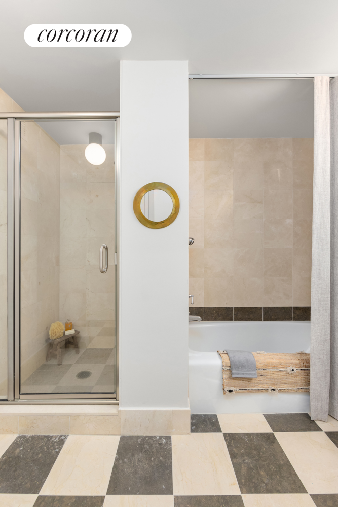 20 River Terrace, Unit 9M Manhattan, NY 10282 - Photo 5 of 11 a bathroom with a shower and a mirror