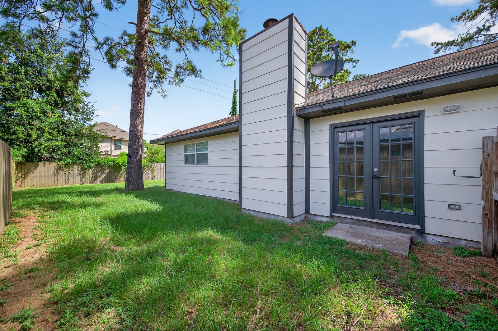 4911 Maurita Drive Spring, TX 77373 - Photo 14 of 15 a front view of a house with a garden