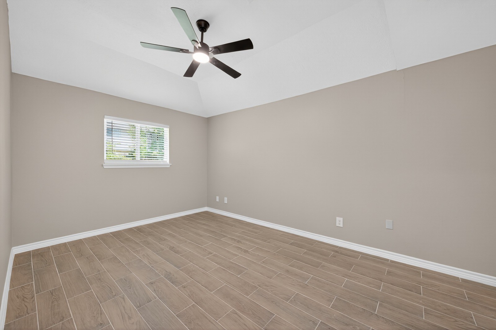 4911 Maurita Drive Spring, TX 77373 - Photo 9 of 15 wooden floor in an empty room with a window