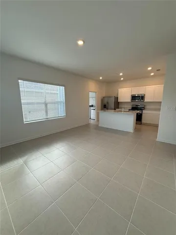 a view of a kitchen with kitchen and a window