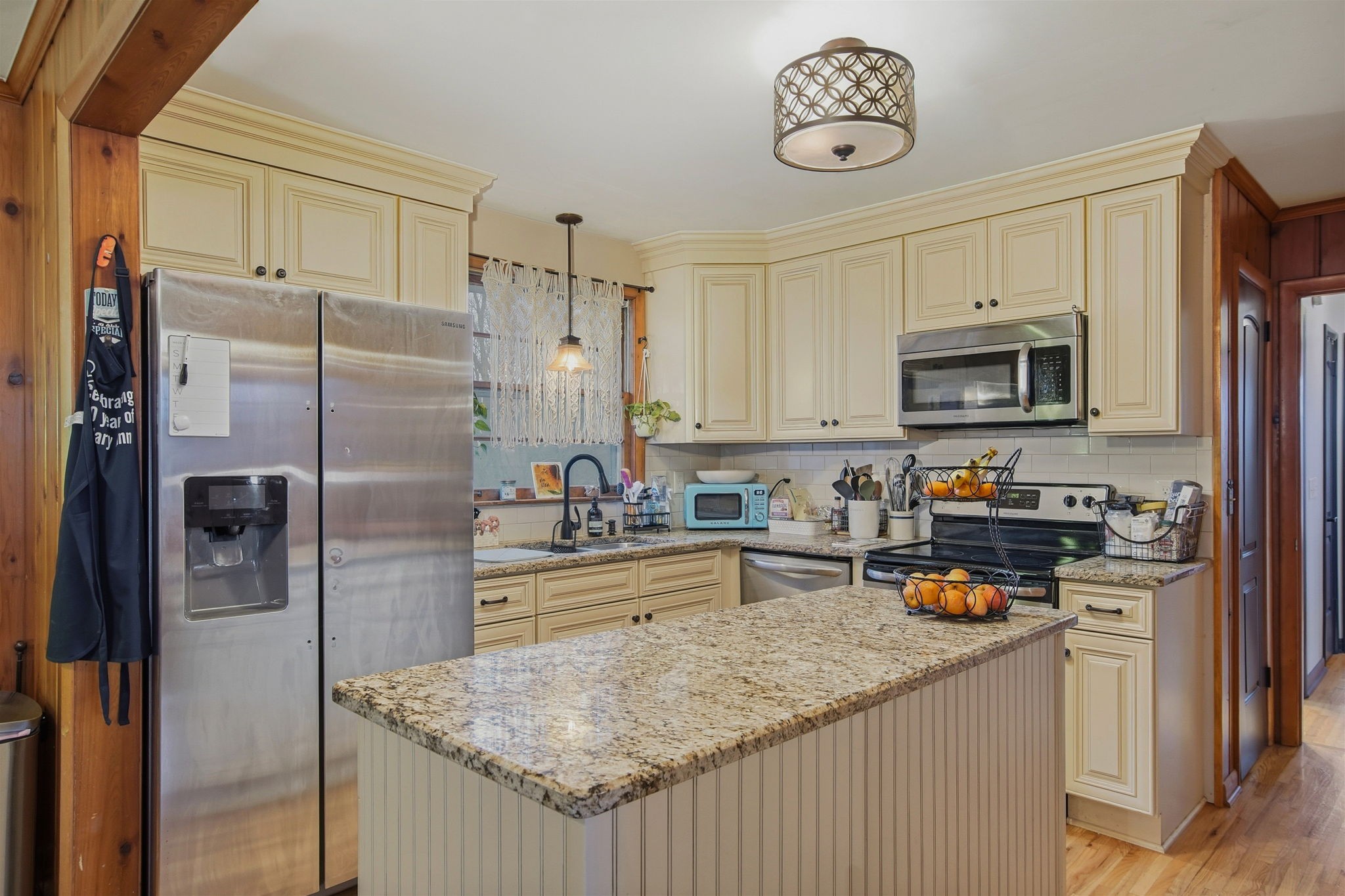 608 Hamblen Drive Madison, TN 37115 - Photo 7 of 27 a kitchen with stainless steel appliances granite countertop a refrigerator a stove and a sink