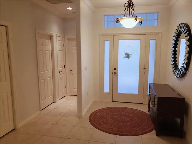 a view of an entryway with a chandelier