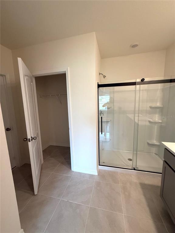 216 Taylor Groves St Lake Lake Wales, FL 33898 - Photo 12 of 18 a view of an empty room with a glass door