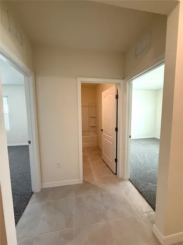 an empty room with a mirror