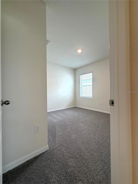 216 Taylor Groves St Lake Lake Wales, FL 33898 - Photo 7 of 18 a view of empty room with window
