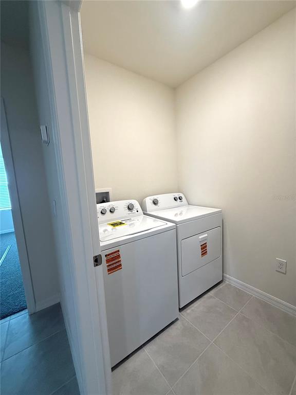 216 Taylor Groves St Lake Lake Wales, FL 33898 - Photo 8 of 18 a utility room with dryer and washer