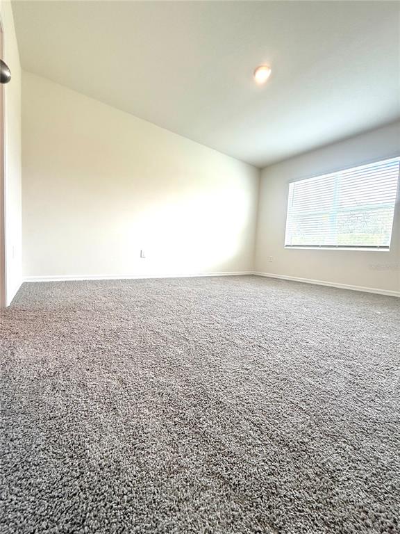 216 Taylor Groves St Lake Lake Wales, FL 33898 - Photo 10 of 18 an empty room with an entryway