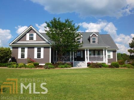 1964 Whitney Road, Unit 102B Monroe, GA 30655 - Photo 1 of 1 a front view of a house with garden